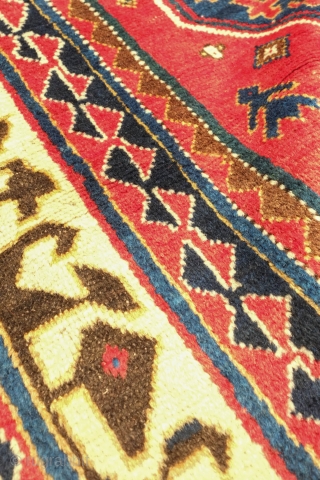 Borchalu Kazak rug, 19th century. Archaic trees inside medallions. There is a headless human figure at the bottom of the rug. Some wear in the center but good pile all around the  ...