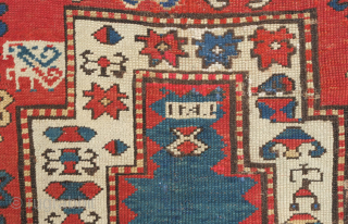 Kazak prayer rug, dated to about 1876. The date is inscribed at the top of the mihrab. 
Note the abstracted beast to the left of the top of the mihrab. Also note  ...