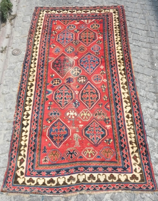 Borchalu Kazak rug, 19th century. Archaic trees inside medallions.  There is a headless human figure at the bottom of the rug.  Some wear in the center but good pile all  ...