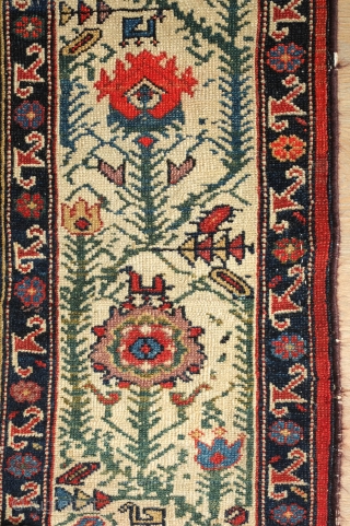 Malayer Rug, 3rd quarter of 19th century.  Abrash and lines bisecting the field.  The red in the elegantly articulated border flowers is not chemical and is madder dyed using a  ...