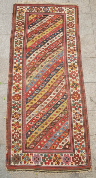 Karabagh Striped Rug, 3rd quarter of 19th Century. Fantastic colors. A gem.  It has some old repairs in some of the brown and red stripes.  107 x 255 cm  