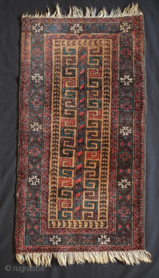 Baluch Balisht.  Sistan or Adraskand. Late 19th/early 20th century.  Tree of life motif with alternating colors in the hooks giving the piece a dynamic motion. Deep purple throughout and camel  ...