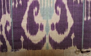 Ikat Adras Hanging Panel, Late 19th to early 20th Century.  Possibly Ferghana Valley.  Purple ground with three types of white pendants.  Five strips.  173 x 214 cm  
