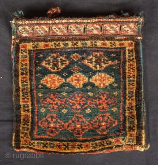 Qashqa'i Chanteh, 19th century.  Deep green-blue ground.  Vivid striped back.  Well executed soumak work on the top.  All good colors.  Selvedge missing and there is a small  ...