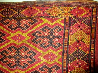 Antique Ersari Turkmen brocaded torba with a lot of silk--at least three colors including mauve, lemon, and the pale green that forms the main lattice design (see last photo).  Complete with  ...