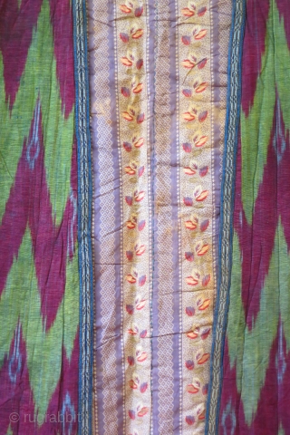 Uzbek coat, silk warp ikat, cotton weft, 19th c.,60 inches across the sleeves, 52 inches high, in excellent condition with light overall soiling ( could stand to be drycleaned).    