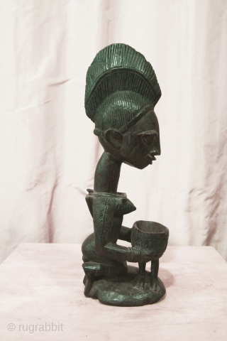 Yoruba female figure, Nigeria, wood, 14 inches high, mid 20thc.,Ex Irwin Hersey col.                    