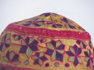 This beautiful hand stitched silk on cotton hat is an early turkmen piece,very fine work and it's a child hat             