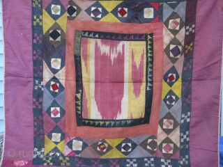 This is an old koraq(patch work)with a silk ikat in the middle part, uzbek tribe from northern Afghanistan,was used as a mirror cover(aenah posh)in the old days,
still in a very good condition. 