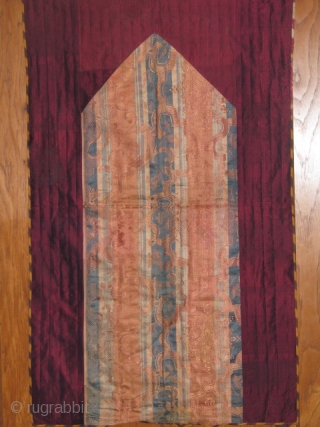 This is a child's prayer cloth made out of old Russian silk textile with interesting unusual design in the middle, bordered with old metallic maroon qassab(turkmen loom made plain textile),on the back  ...