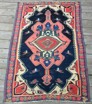 Antique Bijar Kilim Rug 3.5 Ft. x 5.25 Ft.
A dynamic design with a great color combination makes the center medallion seem to float in mid-air. This rug has a magnetic quality. The  ...