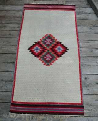 Antique Mexican Serape -Wool on Linen -74" by 38" This is a Saltillo style serape where the diamond center is an aggregate of four diamonds on a spot-repeat field with zigzag borders.
The  ...