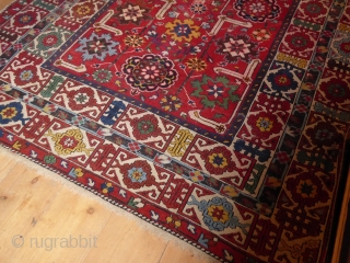 Coming soon ... Rather beautiful, with a bright festive red ground, this Shriven/Kuba small carpet is unusual for it's size; it has an attractive field of stylised floral medallions, enclosed within a  ...