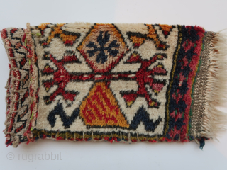 Fragmented 'transcaucasian '( mainly ) bag . Ca ; 18 cm x 32 cm . thick,   long wool and  colors.          