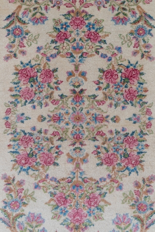 Kerman Runner

3.0 by 14.3
0.91 x 4.35

The old ivory field of this high pile SE Persian Kerman has a Westernizing floral bouquet and acanthus design within open millefleurs and tendril borders in the  ...