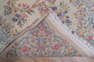 Kerman Runner

3.0 by 14.3
0.91 x 4.35

The old ivory field of this high pile SE Persian Kerman has a Westernizing floral bouquet and acanthus design within open millefleurs and tendril borders in the  ...