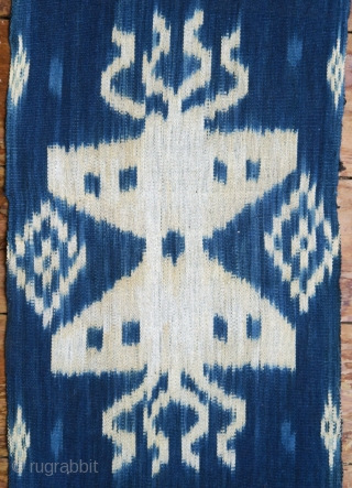 Sumba | indigo ikat men’s headcloth | Indonesia

East Sumba, Kanatang, 2nd half of 20th century

Commercial cotton, natural indigo dye, warp ikat

A headcloth (tiara) woven with large white ikat figures on an indigo  ...