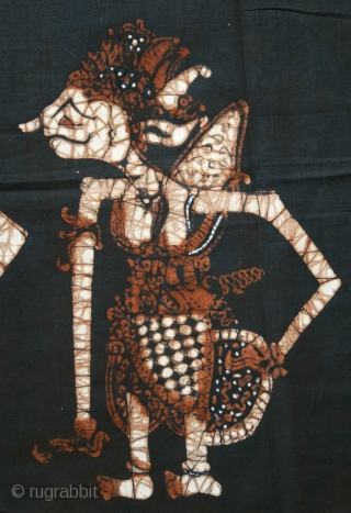 Javanese Batik Wall Hanging with Wayang Figures
 
Origin: Indonesia, Java, Jogjakarta, 1940 – 1960

Technique: Commercial cotton, mixed dyes, hand-drawn (tulis) batik

Description: A dramatic batik hanging from Jogjakarta, hand-drawn with wayang kulit (shadow  ...