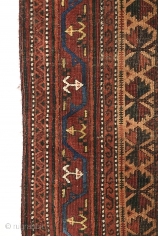 Late 19th century Baluch prayer rug with a colorful border. Measures 150cm x 81cm. All natural colors.                