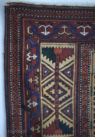 Late 19th century Baluch prayer rug with a colorful border. Measures 150cm x 81cm. All natural colors.                
