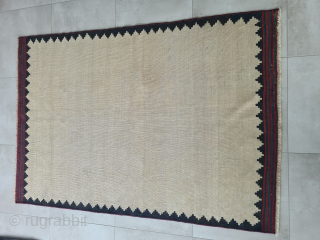 Persian Bakhtiary or Luri sofreh kilim with minimalistic nomadic pattern and naturel dyes. Two small not visible repairs in the  bright area. The edges are bordered

158x108cm 

Probably wovrn in the first  ...