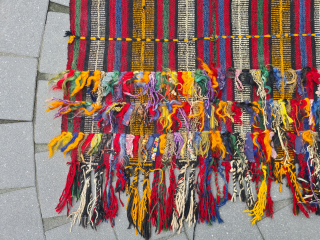 Beautiful nomadic horse blanket from Southeast Anatolia (area between Adana, Urfa and Gaziantep) with interesting metal threads, mohair braids and fabric decorations. Woven in three panels using the Cicim technique. Nice tribal  ...