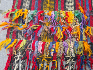 Beautiful nomadic horse blanket from Southeast Anatolia (area between Adana, Urfa and Gaziantep) with interesting metal threads, mohair braids and fabric decorations. Woven in three panels using the Cicim technique. Nice tribal  ...