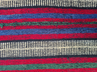 Beautiful nomadic horse blanket from Southeast Anatolia (area between Adana, Urfa and Gaziantep) with interesting metal threads, mohair braids and fabric decorations. Woven in three panels using the Cicim technique. Nice tribal  ...