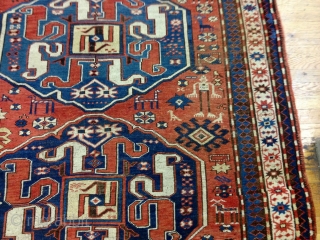 CAUCASIAN CLOUDBAND KAZAK
5'2 by 7'5 ft
Ends and sides are in perfect shape
1880's or earlier
No restoration done
Black oxidations
Ethnic and primitive designs
Vibrant,brilliant colors
            