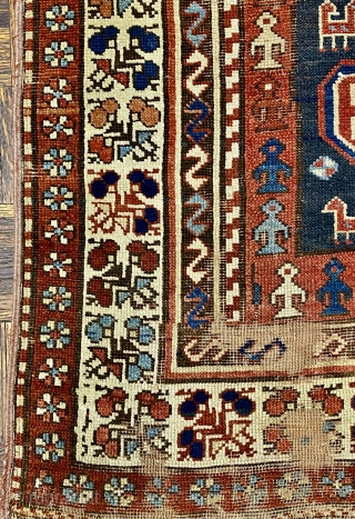 Kurdish Long Rug, 3’11 x 9’10 / 119 x 300 cm., Field divided
into four sections, each section contains a quatrefoil medallion
surrounded by small animals, angular “S” -shaped and reciprocal
floral sprays in borders 