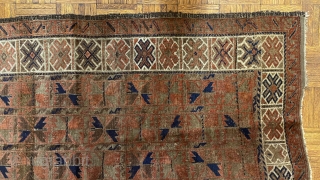 Afghan Balauch rug, ca. 1880;  3’4” x 6’6” / 102 x 198 cm.;

Field of “boxed cabbage” leaves and a running dog border variant as 

trunks and branches. Main border cross-hatch totems  ...