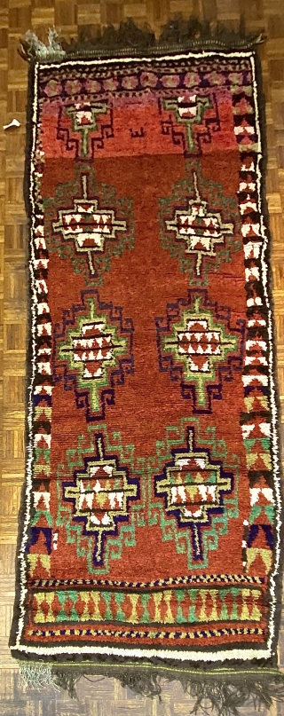 Uzbek long rug/ carpet with Gabbeh weave, ca. 1890, 4’11” x 11’9” / 150 x 358 cm.

Three shade of red in the ground, two madder reds and one slightly tip-faded red-violet which  ...