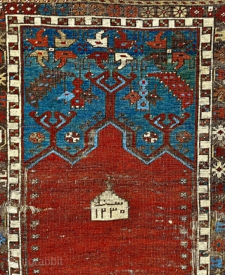 Antique Ladik Prayer rug, dated A.H. 1230 ( 1815 CE); 3’7” x 6’5”

Woven a relatively long vertical shape, this Ladik features the classic

arrangement of a red, triple-arch mihrab set above a panel  ...