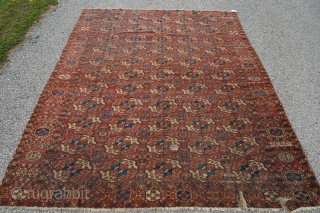 Beautiful 3rd quarter 19th century Tekke main rug. 8ft x 6ft 6in. Unusual minor border and gul. Mostly low pile, one square patch was removed, two tears on one end, and one  ...