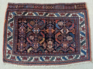 Antique Afshar bag. 2ft1in x 2ft8in. Great design on a deep indigo field. Wonderful rich colors throughout and the sumak weaving on the top of the bag is in perfect condition with  ...