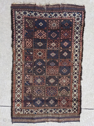 Archaic looking Baluch with incredible range of colors. Look at that main panel on the right!  Maybe a student practice piece or some kind of script?  3ft 11in x 2ft  ...
