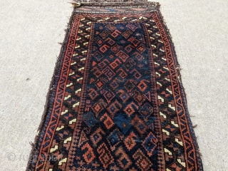 Gorgeous 19th century Baluch balisht. Complete piece with front, back, and goat hair loops. These small bags are a true work of art. 1'6" x 3'2" or 46 x 92cm

Cheers.   