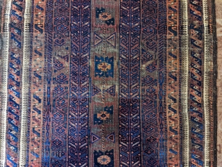 Antique Baluch rug. Beautiful glowing blues. Some of the intricate wefted kilim ends remain.                   