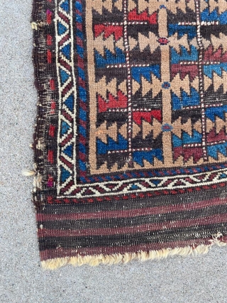 Unique, old and non commercial Baluch rug. 2'9" x 4'8". Some scattered small repairs, overall good pile. Former Jim Dixon collection.            