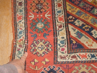 wonderful antique 1880 gendjeh rug, wonderful natural colors, great fuchsia color also, 
some minor low pile, two small repairs, complete headends, two deliberate incisions, to make it lay perfectly flat, no stains

110x263cm
3.7x8.8ft 