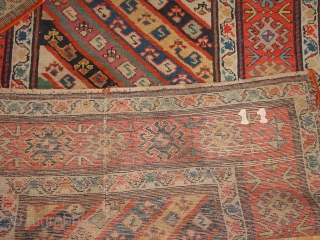 wonderful antique 1880 gendjeh rug, wonderful natural colors, great fuchsia color also, 
some minor low pile, two small repairs, complete headends, two deliberate incisions, to make it lay perfectly flat, no stains

110x263cm
3.7x8.8ft 