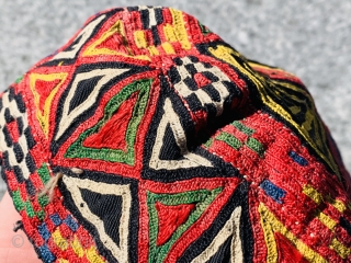 	A fully embroidered hat from Central Asia. They are composed of silk embroidery on cotton and linen..                