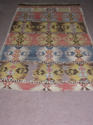 Wonderful Anatolian Kilim.it is an early piece,wool but best quality wool,very fine texture weaving,wonderfull naturel colours.great figures,graphic.the colours are really great and good combination.one end is missing and some holes.please feel free  ...