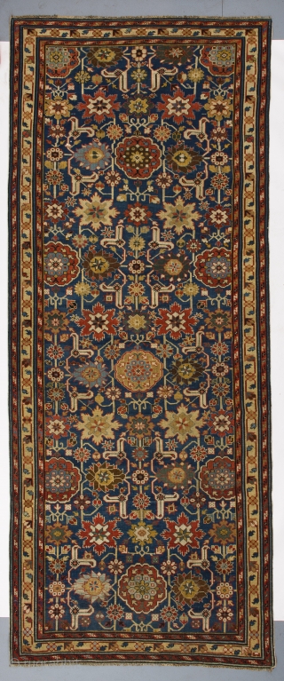 Afshan Kuba long rug from NE Caucasus, 4.3 x 10 Ft (128x298 cm), ca 1800. Provenance: a private collection in England.            