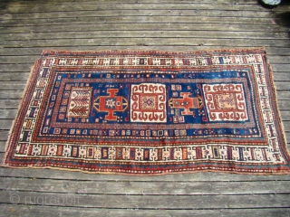 Karachof Kazak rug with full pile and intact kilim endings. Unusual directional pattern, great colors and lustrous wool. Two rough corners as shown and several secured holes that are visible from the  ...