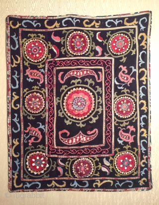 A dynamic Antique Uzbek silk suzani / Susani dating to late 19th Century from rural areas of shahrisabz. It has fine chain stitched silk on a dark indigo silk woven ground. The  ...