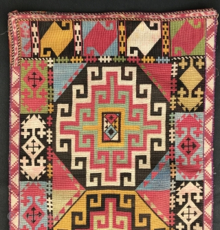 An outstanding example of Antique Uzbek Lakai tribe silk cross stitched shield shaped talismanic hanging known as Uut Kap Ilgich, dating to the 19th century. This is one of the best examples  ...