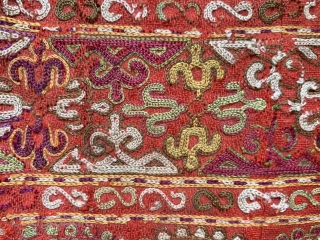 An exceptional antique Turkoman Turkmen Chodor tribe silk embroidered sleeve (opened) dating to the19th century. Chodor silk needlework were often done on red bannat trade cloth and were some of the finest  ...