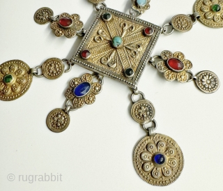 A rare antique silver with gold appliqué  talismanic crown for boy’s hat made by the Yomud / Yomut tribe Turkoman / Turkmen, dating to the 19th century.. These were made by  ...