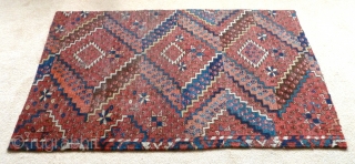 A beautiful fragment from an Ersari Beshir main carpet. Middle Amu Darya region, early 19th Century. The four sides are secured by ticking sewn on the back. 4'2" x 2'6" / 127  ...